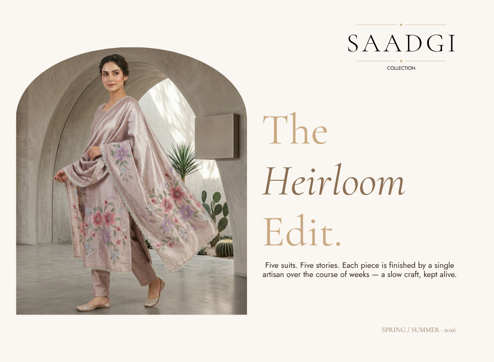 A woman models an elegant mauve-pink embroidered salwar suit from the Saadgi collection, framed in an architectural archway. Text on the right reads "The Heirloom Edit" for the Spring/Summer 2026 collection, showcasing premium Indian suits online Canada.